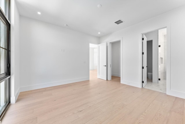 880 NE 3rd Ave, Boca Raton, FL 33432 - unfurnished bedroom with light wood-style floors, recessed lighting, and baseboards