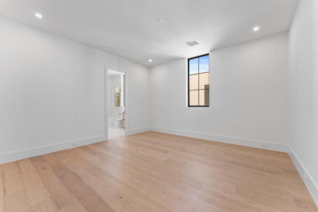 880 NE 3rd Ave, Boca Raton, FL 33432 - spare room featuring light wood-style flooring, baseboards, and recessed lighting
