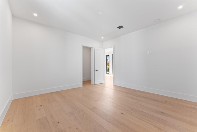 880 NE 3rd Ave, Boca Raton, FL 33432 - spare room with light wood finished floors, baseboards, and recessed lighting