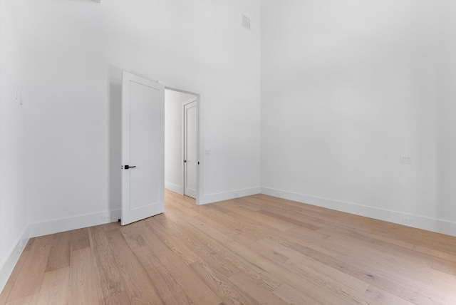 880 NE 3rd Ave, Boca Raton, FL 33432 - spare room with light wood-style flooring and baseboards