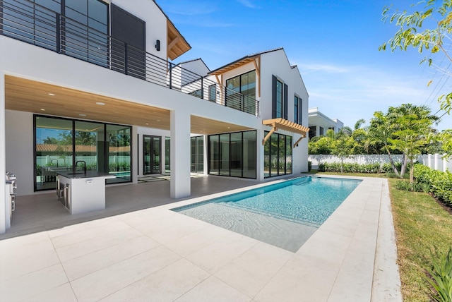 880 NE 3rd Ave, Boca Raton, FL 33432 - view of swimming pool with fence, a patio, and a sink