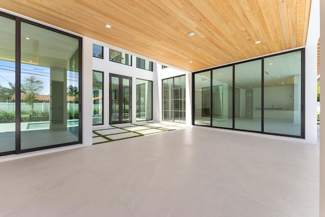 880 NE 3rd Ave, Boca Raton, FL 33432 - unfurnished sunroom featuring french doors