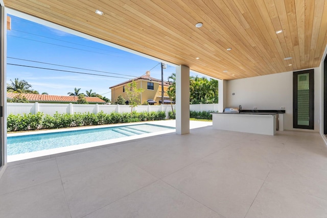 880 NE 3rd Ave, Boca Raton, FL 33432 - view of swimming pool with area for grilling, a patio, and a fenced backyard
