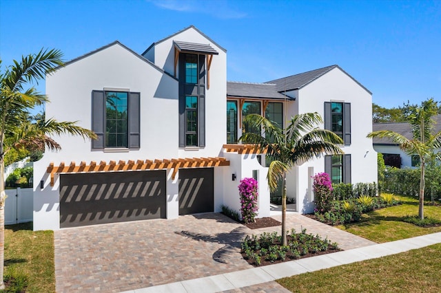 880 NE 3rd Ave, Boca Raton, FL 33432 - view of front of property with stucco siding, a garage, fence, and driveway