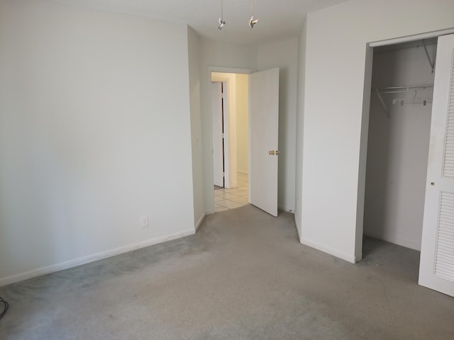 2231 NW 34th Ter, Coconut Creek, FL 33066 - unfurnished bedroom featuring a closet, baseboards, and carpet