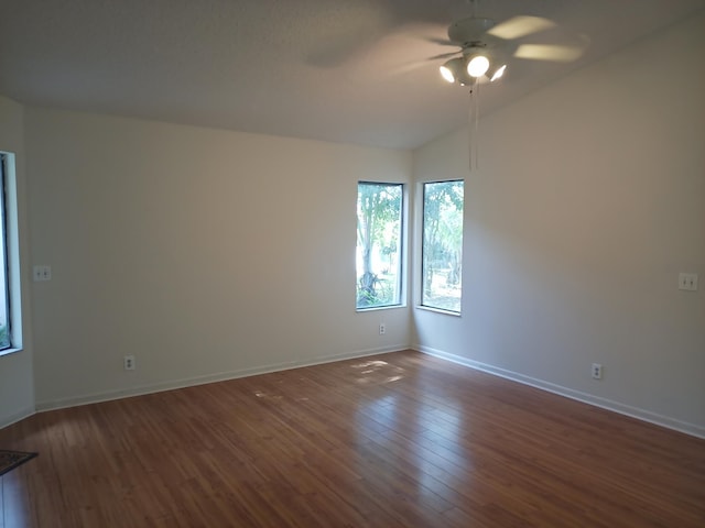 2231 NW 34th Ter, Coconut Creek, FL 33066 - empty room featuring vaulted ceiling, baseboards, ceiling fan, and dark wood-style flooring