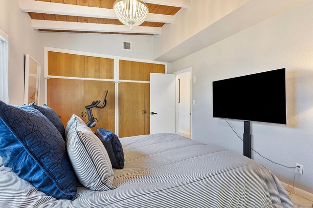 5400 NE 1st Ter, Oakland Park, FL 33334 - bedroom with vaulted ceiling with beams, wood ceiling, visible vents, and a chandelier