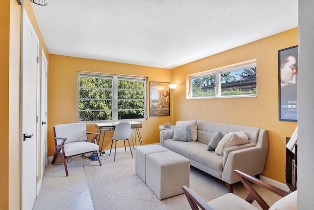 5400 NE 1st Ter, Oakland Park, FL 33334 - living room featuring a textured wall, baseboards, and a textured ceiling