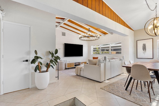 living area featuring visible vents, vaulted ceiling with beams, light tile patterned floors, wooden ceiling, and an inviting chandelier