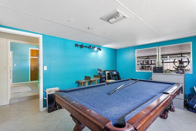 5400 NE 1st Ter, Oakland Park, FL 33334 - recreation room with visible vents, pool table, a textured ceiling, tile patterned floors, and a textured wall