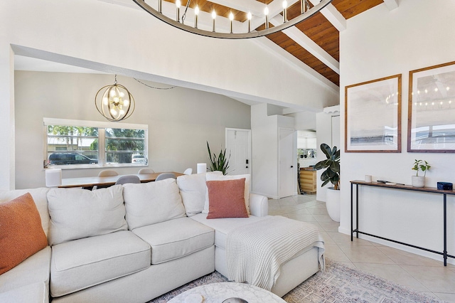 living room featuring beamed ceiling, a notable chandelier, high vaulted ceiling, light tile patterned flooring, and wood ceiling