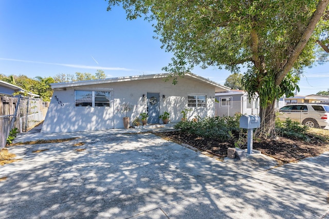 5400 NE 1st Ter, Oakland Park, FL 33334 - ranch-style home featuring stucco siding and fence