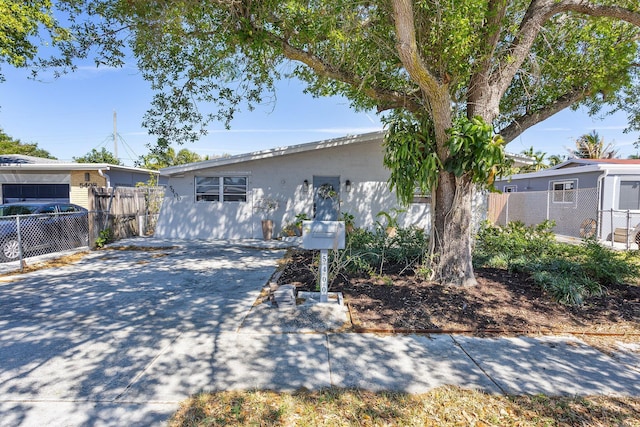 5400 NE 1st Ter, Oakland Park, FL 33334 - view of front of house featuring fence and stucco siding
