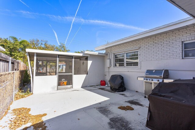 5400 NE 1st Ter, Oakland Park, FL 33334 - view of patio / terrace with fence and a sunroom