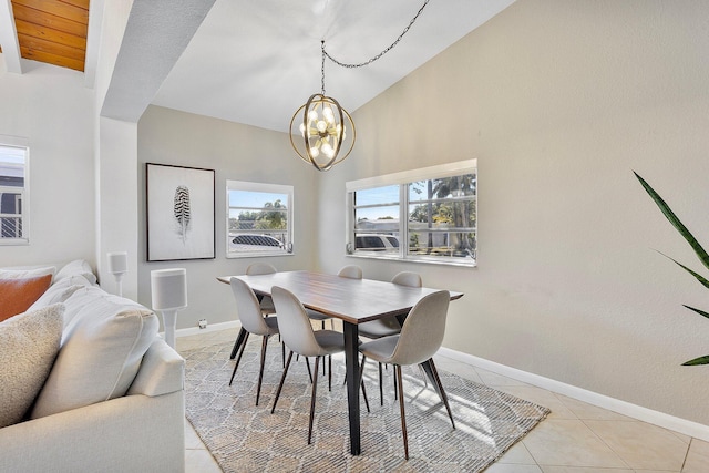5400 NE 1st Ter, Oakland Park, FL 33334 - dining room with baseboards, lofted ceiling, a chandelier, and light tile patterned flooring