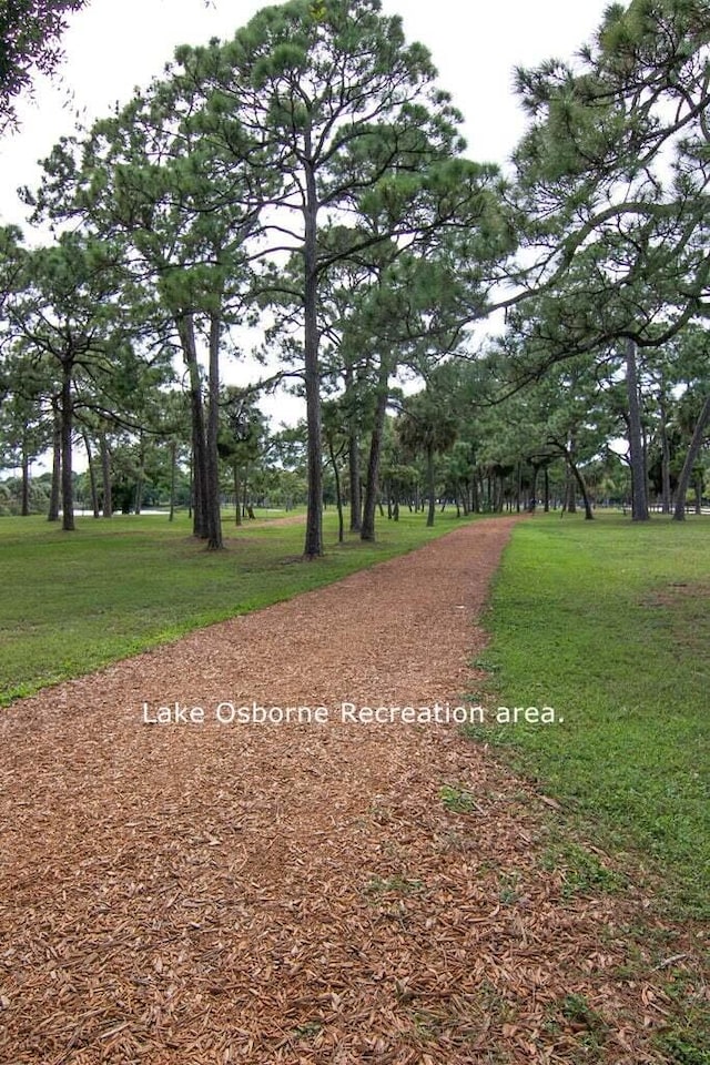 view of property's community featuring a yard