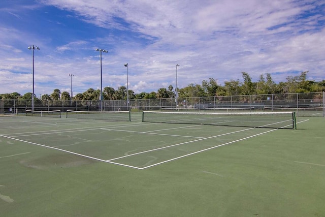 view of sport court with fence