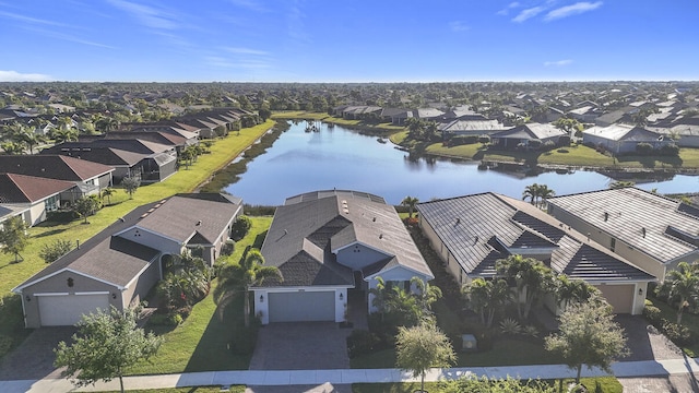 bird's eye view with a residential view and a water view
