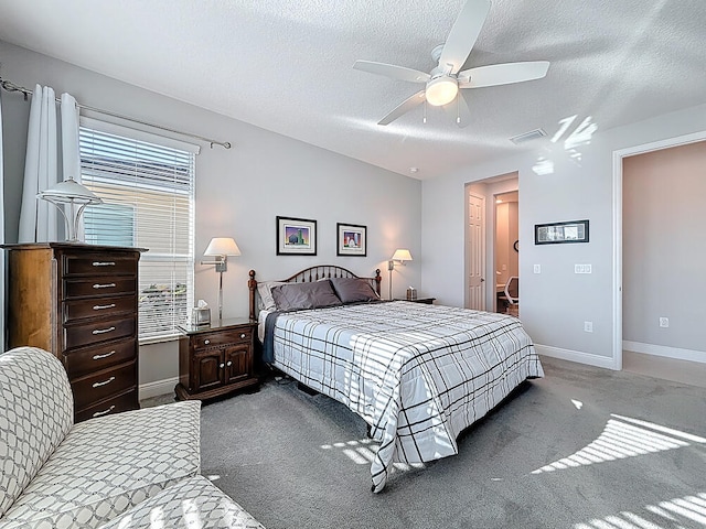bedroom featuring visible vents, a ceiling fan, a textured ceiling, carpet flooring, and baseboards