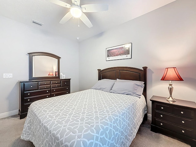 bedroom featuring carpet flooring, baseboards, visible vents, and ceiling fan