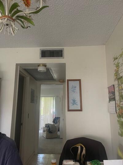 bedroom with visible vents and a textured ceiling