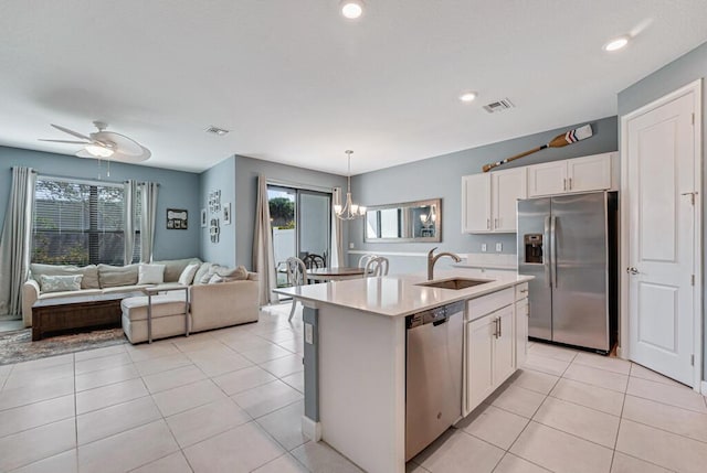 1012 Willow Pl, Riviera Beach, FL 33410 - kitchen with stainless steel appliances, a sink, light countertops, healthy amount of natural light, and recessed lighting