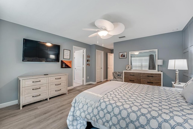 1012 Willow Pl, Riviera Beach, FL 33410 - bedroom with light wood finished floors, baseboards, and ceiling fan