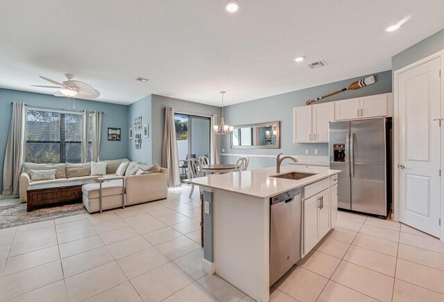 1012 Willow Pl, Riviera Beach, FL 33410 - kitchen featuring stainless steel appliances, a sink, healthy amount of natural light, light countertops, and recessed lighting