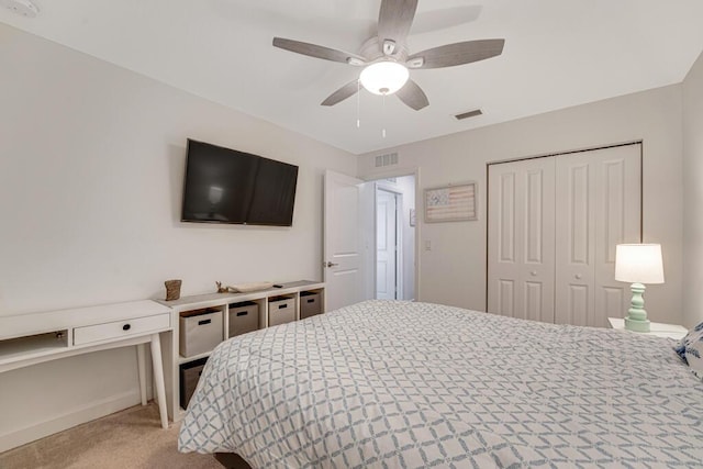1012 Willow Pl, Riviera Beach, FL 33410 - bedroom featuring light carpet, baseboards, a closet, and a ceiling fan