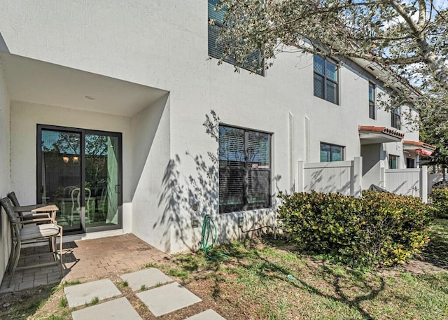 1012 Willow Pl, Riviera Beach, FL 33410 - view of exterior entry featuring stucco siding