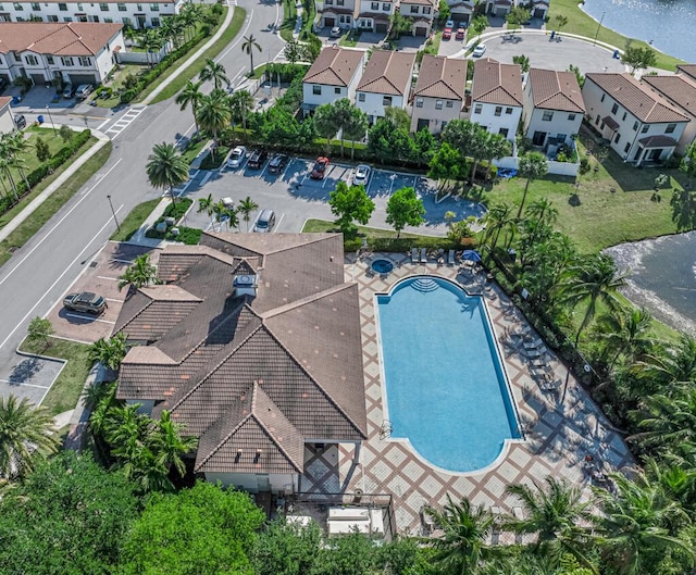1012 Willow Pl, Riviera Beach, FL 33410 - drone / aerial view of a pool and a nearby body of water