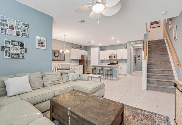 1012 Willow Pl, Riviera Beach, FL 33410 - living room with ceiling fan, stairway, light tile patterned floors, recessed lighting, and baseboards
