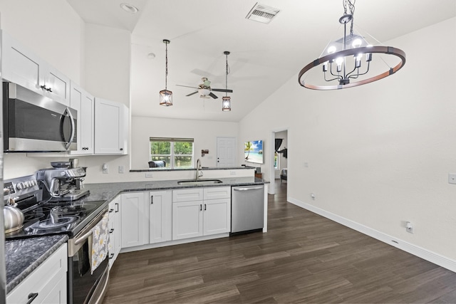 7633 NW 93rd Ct, Okeechobee, FL 34972 - kitchen featuring visible vents, a peninsula, stainless steel appliances, a sink, and ceiling fan with notable chandelier
