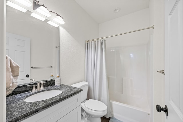 7633 NW 93rd Ct, Okeechobee, FL 34972 - bathroom with toilet, vanity, a textured wall, and shower / bath combo with shower curtain
