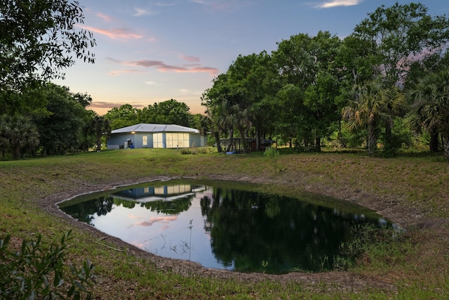 7633 NW 93rd Ct, Okeechobee, FL 34972 - exterior space with a lawn and a water view
