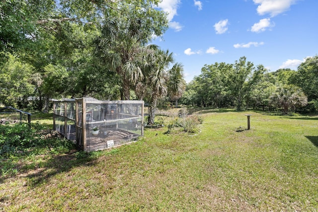 7633 NW 93rd Ct, Okeechobee, FL 34972 - view of yard with an outbuilding