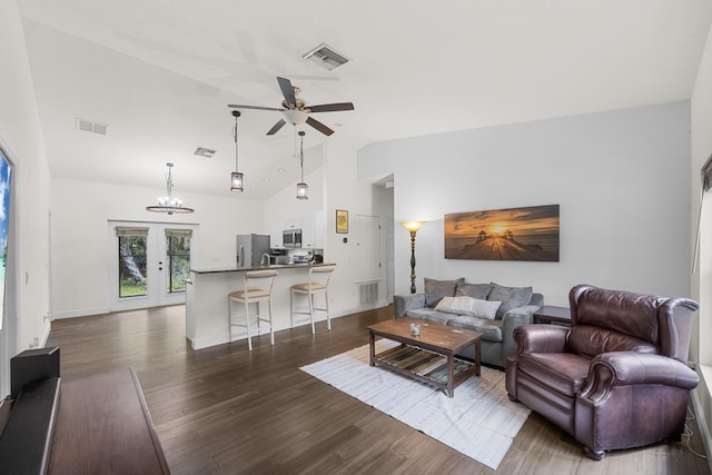 7633 NW 93rd Ct, Okeechobee, FL 34972 - living room featuring dark wood finished floors, ceiling fan with notable chandelier, and visible vents
