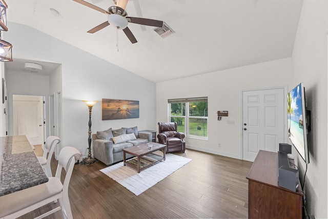 7633 NW 93rd Ct, Okeechobee, FL 34972 - living room featuring a ceiling fan, dark wood-type flooring, lofted ceiling, and visible vents