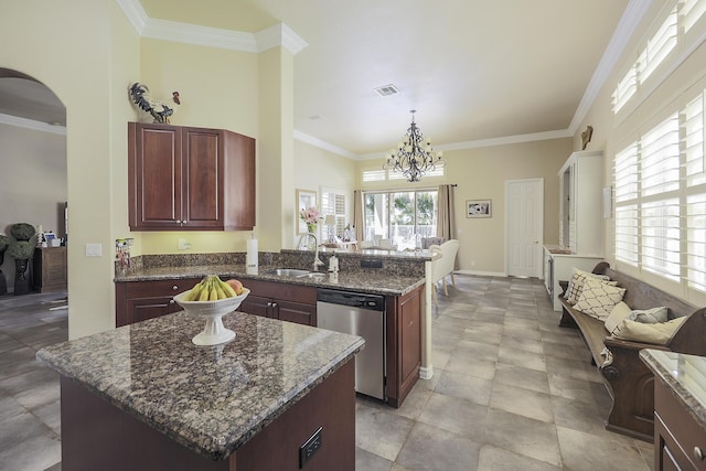 kitchen with dark brown cabinets, ornamental molding, a center island, a sink, and stainless steel appliances