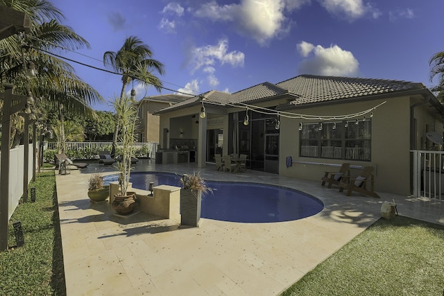 1289 Beacon Cir, Wellington, FL 33414 - back of house featuring stucco siding, a tile roof, and a patio