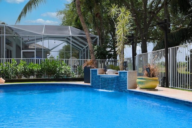 1289 Beacon Cir, Wellington, FL 33414 - view of swimming pool with a lanai