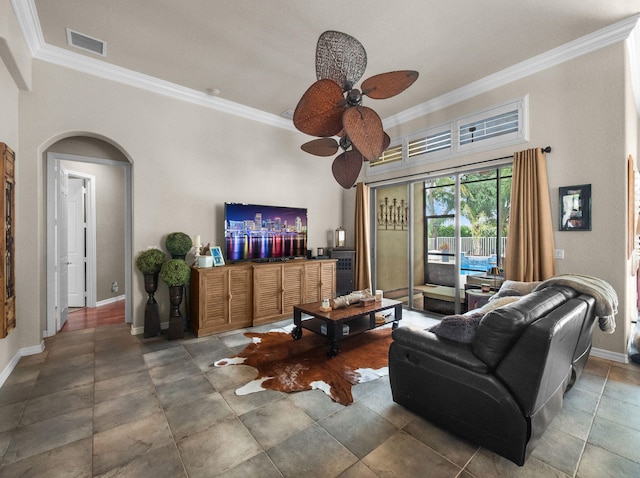 1289 Beacon Cir, Wellington, FL 33414 - living area with ceiling fan, crown molding, arched walkways, and baseboards