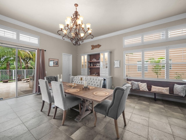 1289 Beacon Cir, Wellington, FL 33414 - dining space featuring ornamental molding, a chandelier, and stone tile flooring