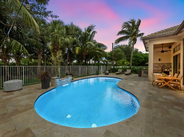 1289 Beacon Cir, Wellington, FL 33414 - view of swimming pool featuring a patio area