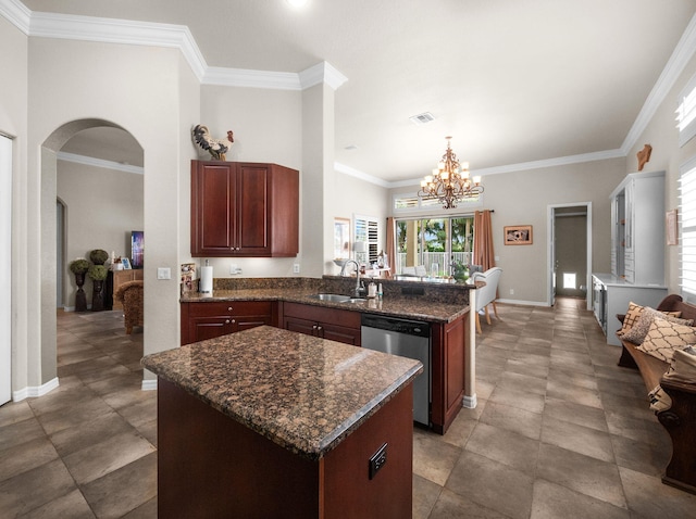 1289 Beacon Cir, Wellington, FL 33414 - kitchen with stainless steel dishwasher, a sink, a peninsula, arched walkways, and a chandelier