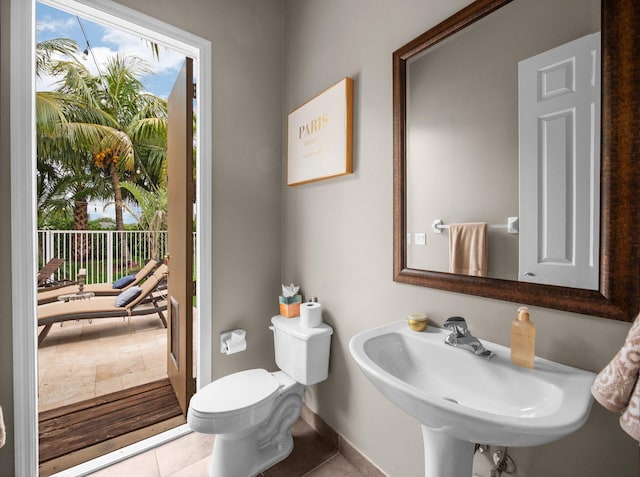 1289 Beacon Cir, Wellington, FL 33414 - bathroom featuring healthy amount of natural light, baseboards, toilet, and a sink