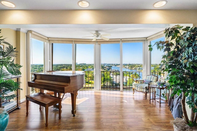 400 Seasage Dr Unit 904, Delray Beach, FL 33483 - living area with ceiling fan, wood finished floors, a water view, and expansive windows