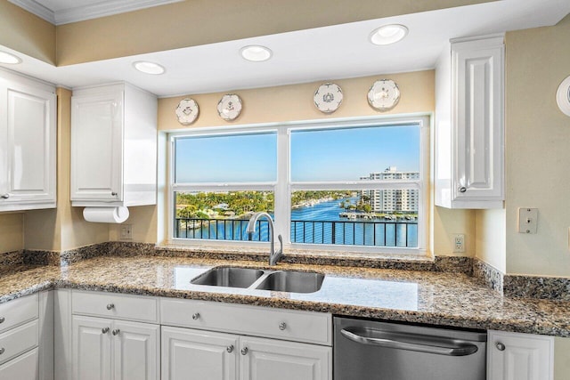 400 Seasage Dr Unit 904, Delray Beach, FL 33483 - kitchen with stainless steel dishwasher, a sink, white cabinetry, recessed lighting, and crown molding