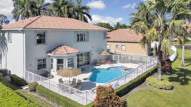 back of property featuring a fenced backyard, stucco siding, a tiled roof, a patio, and cooling unit