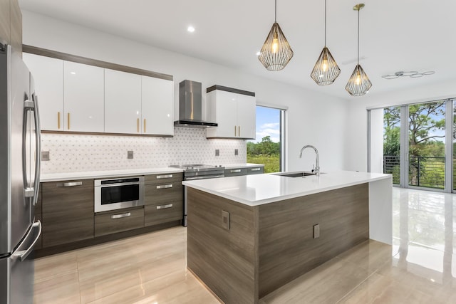 4240 NW 17th Ave, Boca Raton, FL 33431 - kitchen with wall chimney exhaust hood, a sink, modern cabinets, stainless steel appliances, and plenty of natural light